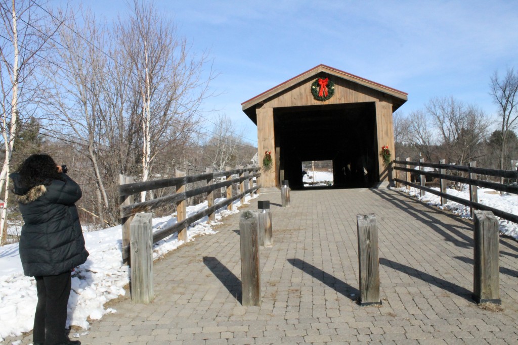 Carol Cain photographs the Jay Covered Bridge. 