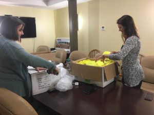 Kerry Shannon and Bethany Valenze pack up the boxes.