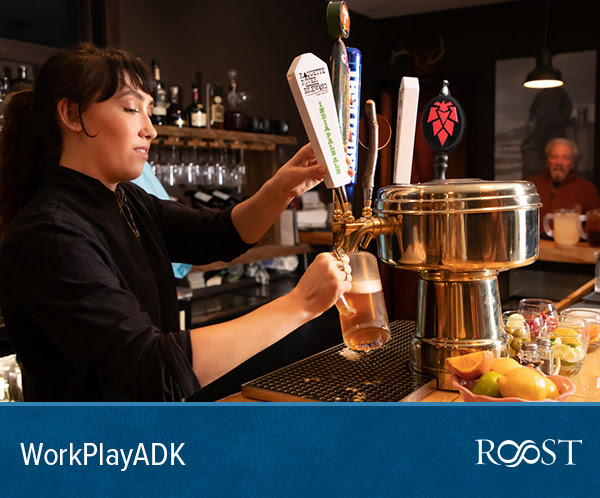 Bartender pours a glass of Adirondack IPA.