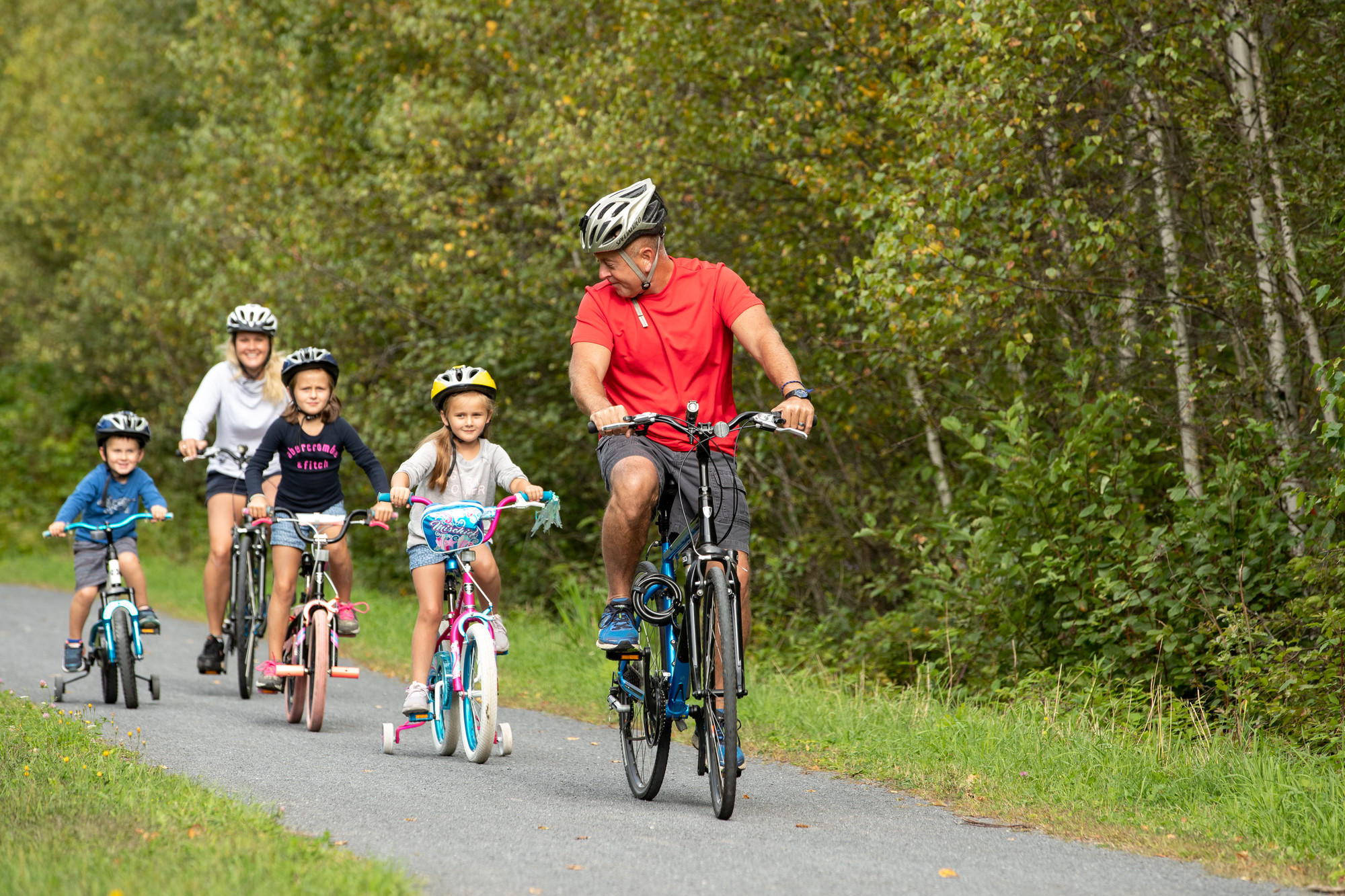 Family bikes the Junction Pass Trail in Tupper Lake